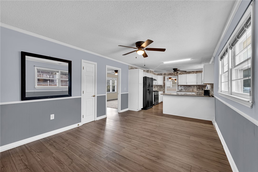 121 Wilson Road Anderson, SC 29625 - Photo 10 of 40 Gleaming wood-look floors anchor a versatile dining space opening directly into the kitchen.