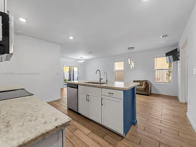 a kitchen with sink and window
