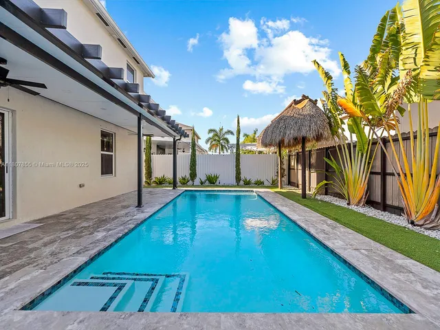 a view of a house with swimming pool