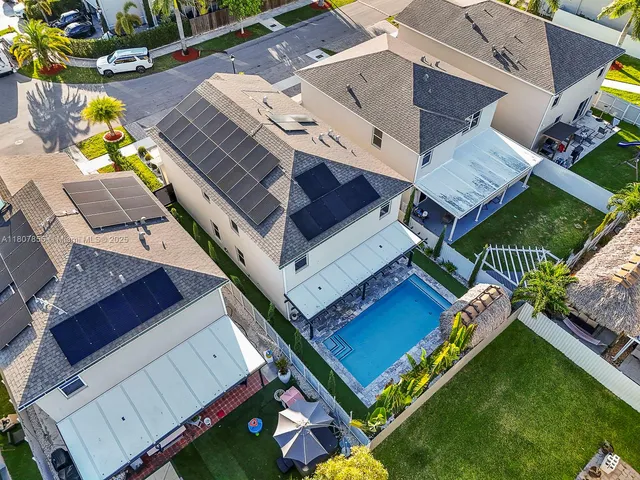 an aerial view of a house with a garden