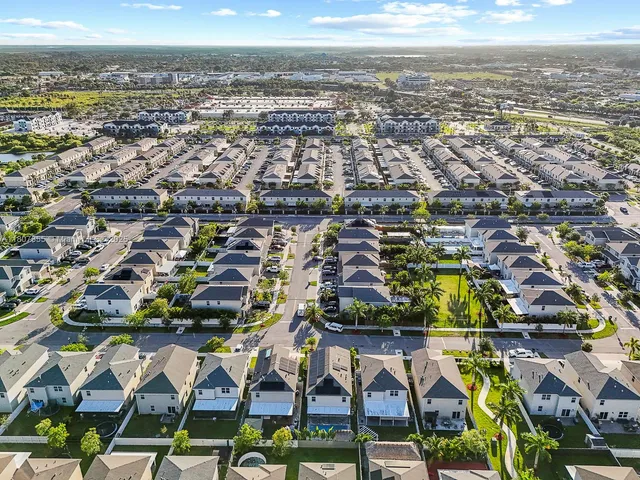 an aerial view of residential building and lake
