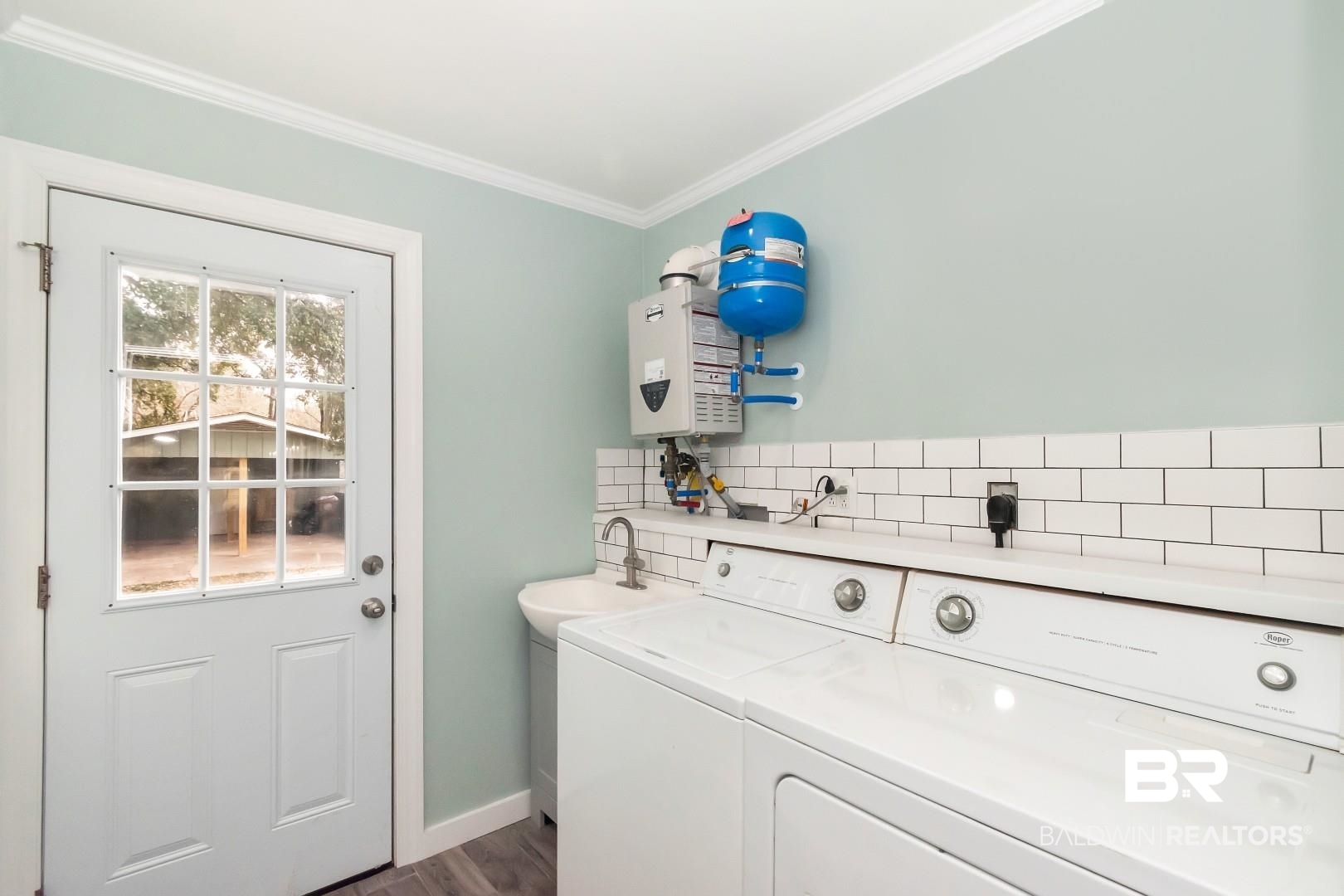 2157 Homewood Street Mobile, AL 36606 - Photo 28 of 36 Laundry room with laundry area, ornamental molding, dark wood-style flooring, independent washer and dryer, and a sink