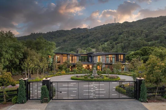 a bedroom with furniture and a large window