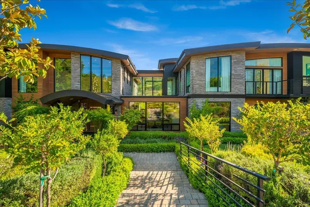 a backyard of a house with lots of green space