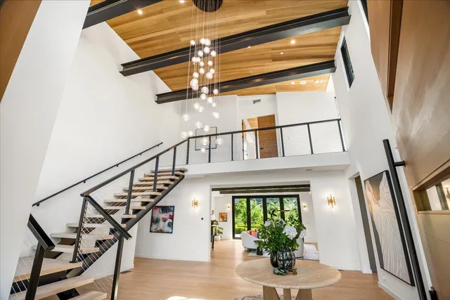 a bedroom with a large bed and a large window