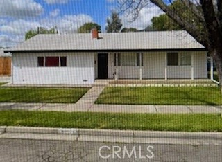 3151 Cherokee Avenue Merced, CA 95340 - Photo 1 of 1 a view of a house with a floor to ceiling window and a yard