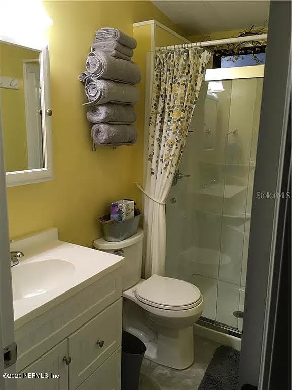 133 Bayou Drive Satsuma, FL 32189 - Photo 17 of 30 a bathroom with a toilet a sink and shower