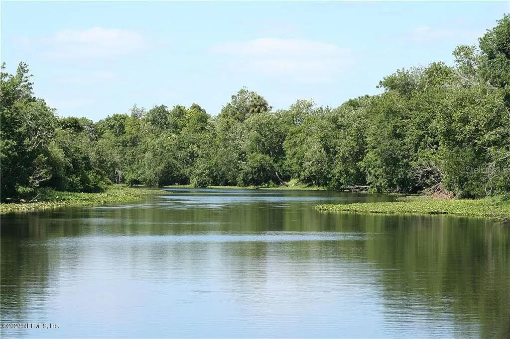 133 Bayou Drive Satsuma, FL 32189 - Photo 23 of 30 a view of a lake with a yard