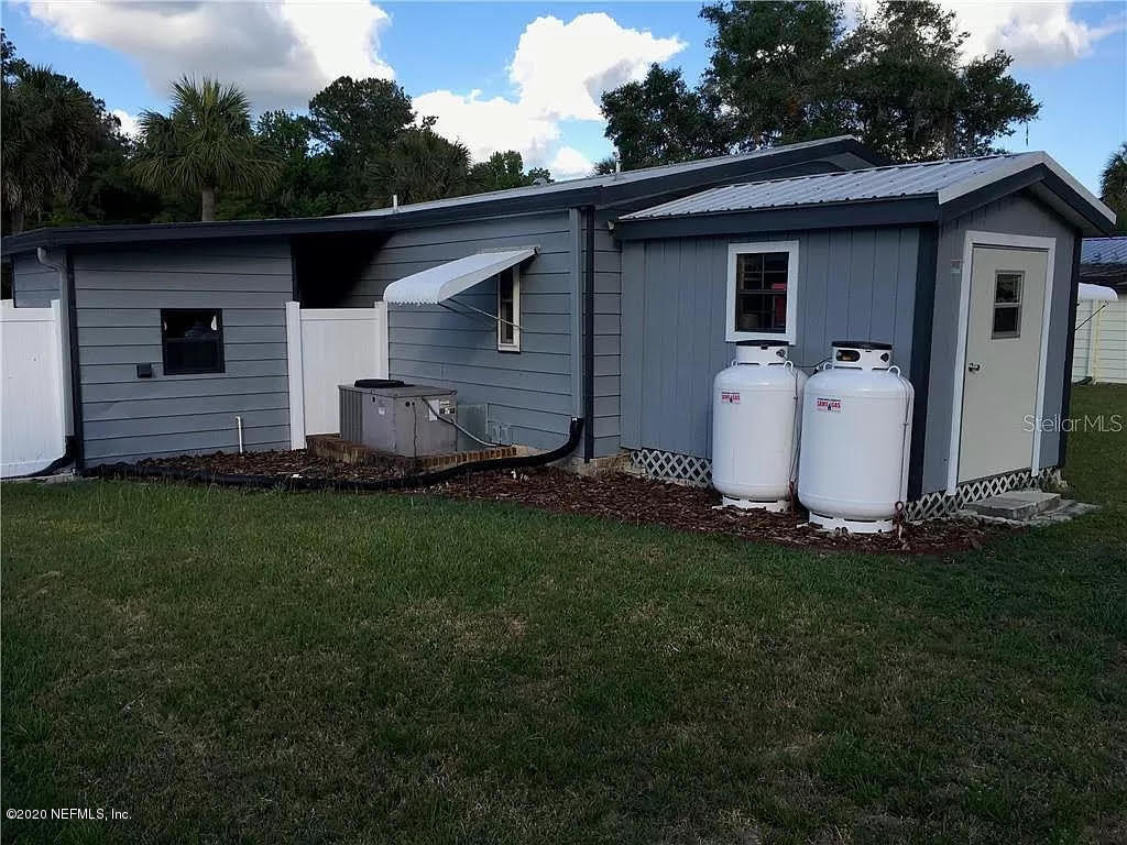133 Bayou Drive Satsuma, FL 32189 - Photo 25 of 30 a view of a backyard with potted plants
