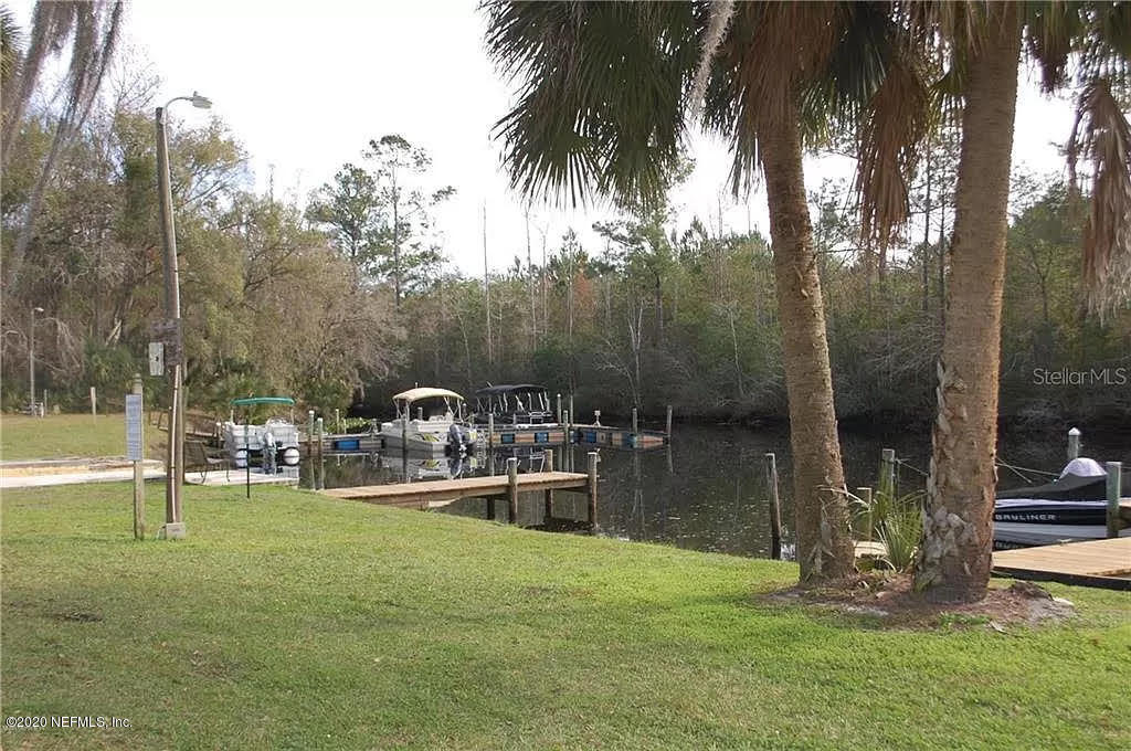 133 Bayou Drive Satsuma, FL 32189 - Photo 28 of 30 a backyard of a house with table and chairs