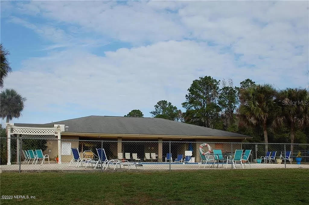 133 Bayou Drive Satsuma, FL 32189 - Photo 29 of 30 a front view of a house with swimming pool table and chairs