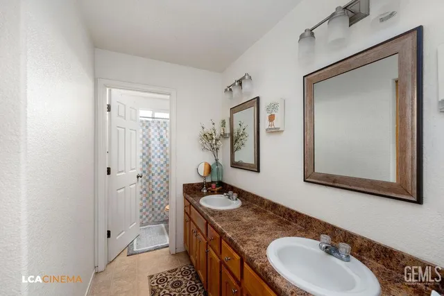 a bathroom with a sink a mirror and a toilet