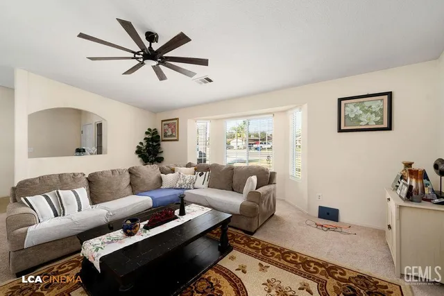 a living room with furniture and a window