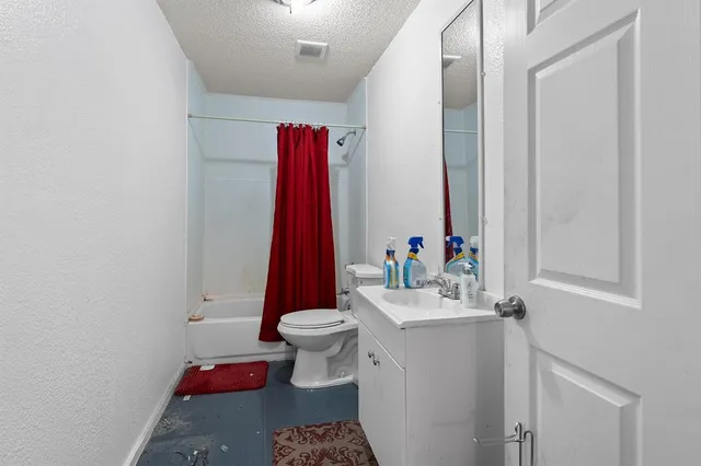 a bathroom with a sink toilet and a mirror
