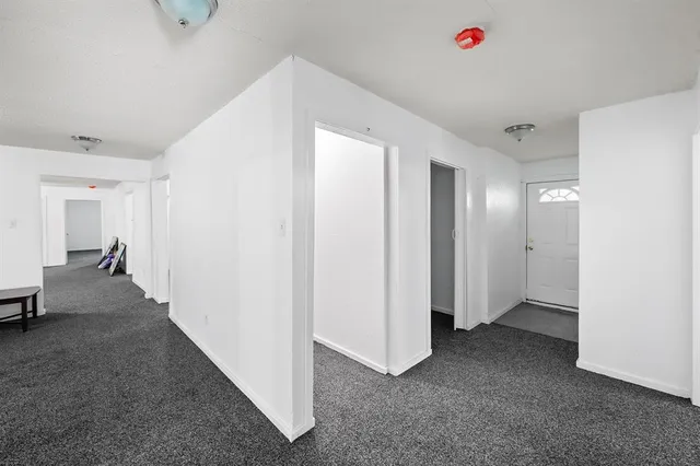 a view of a dining room with furniture and window