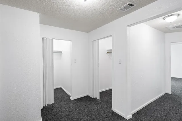 a view of hallway with closet