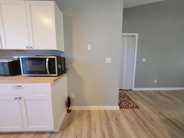 a view of a kitchen from the hallway