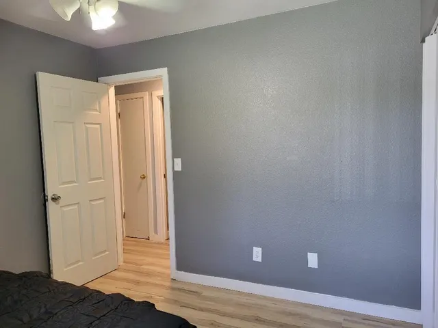 a view of livingroom with hardwood floor and ceiling fan