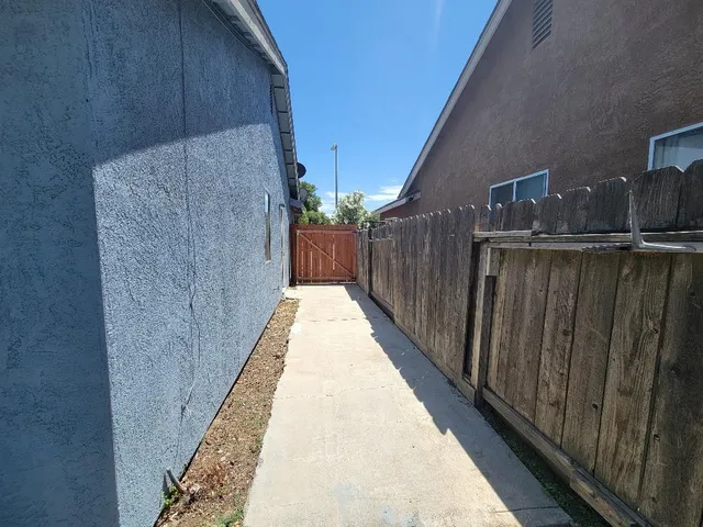 a view of balcony with wooden floor