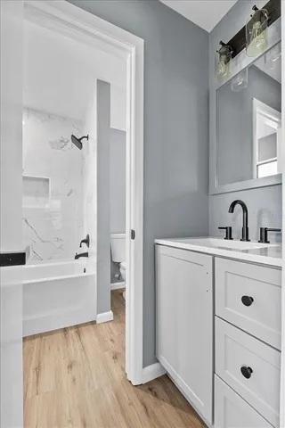 a bathroom with a bathtub and a sink