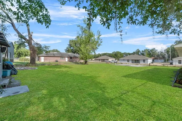 a view of a house with a back yard
