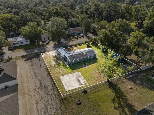 a view of a yard with chairs