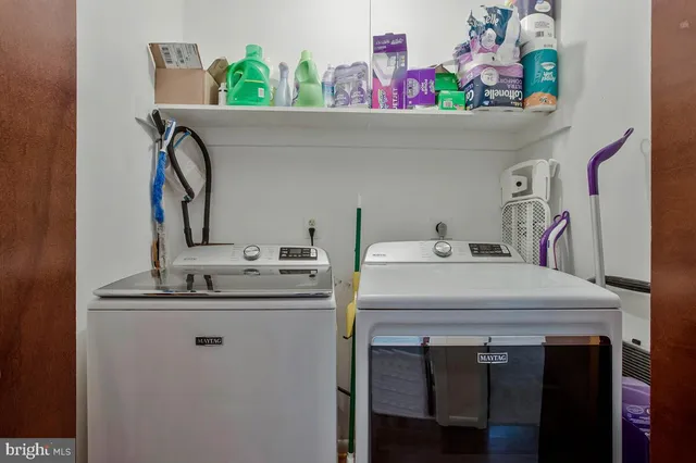 a utility room with a sink a washer and dryer