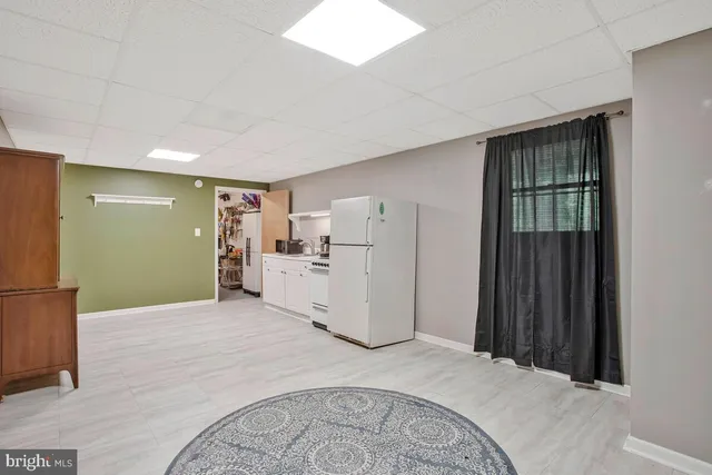 a white toilet sitting next to a bathroom sink