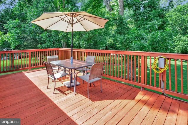 a big yard with lots of green space and trees