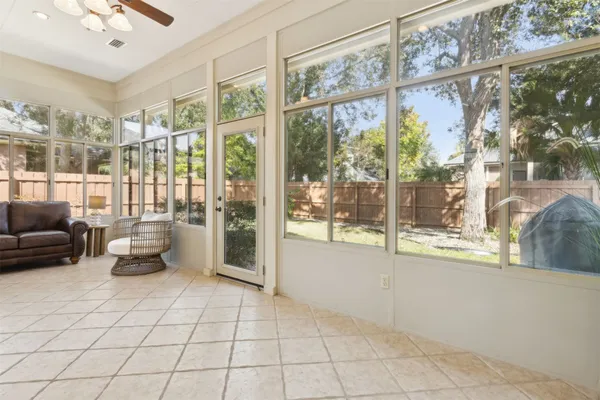 a view of a patio with a dining table and chairs