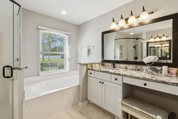 a view of a house with swimming pool and sitting area