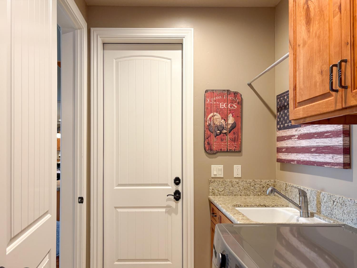 2920 Martel Creek Road Rescue, CA 95672 - Photo 16 of 69 a bathroom with a granite countertop sink and a mirror