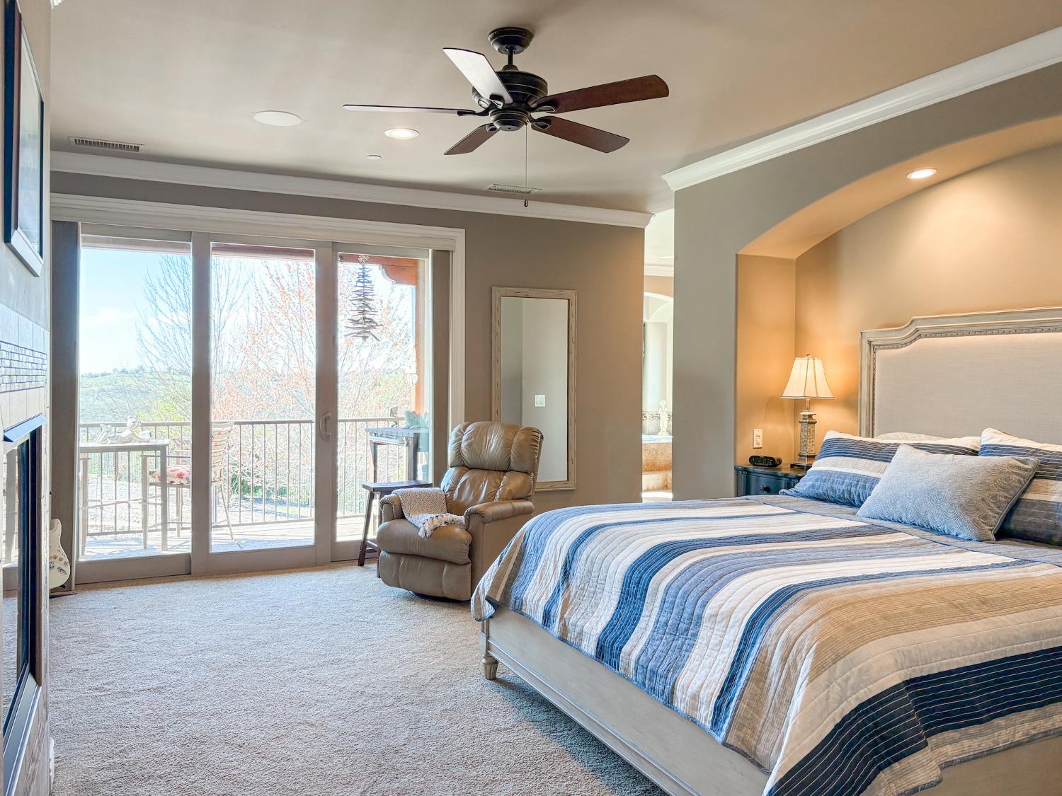 2920 Martel Creek Road Rescue, CA 95672 - Photo 24 of 69 a bedroom with a large bed and a large window