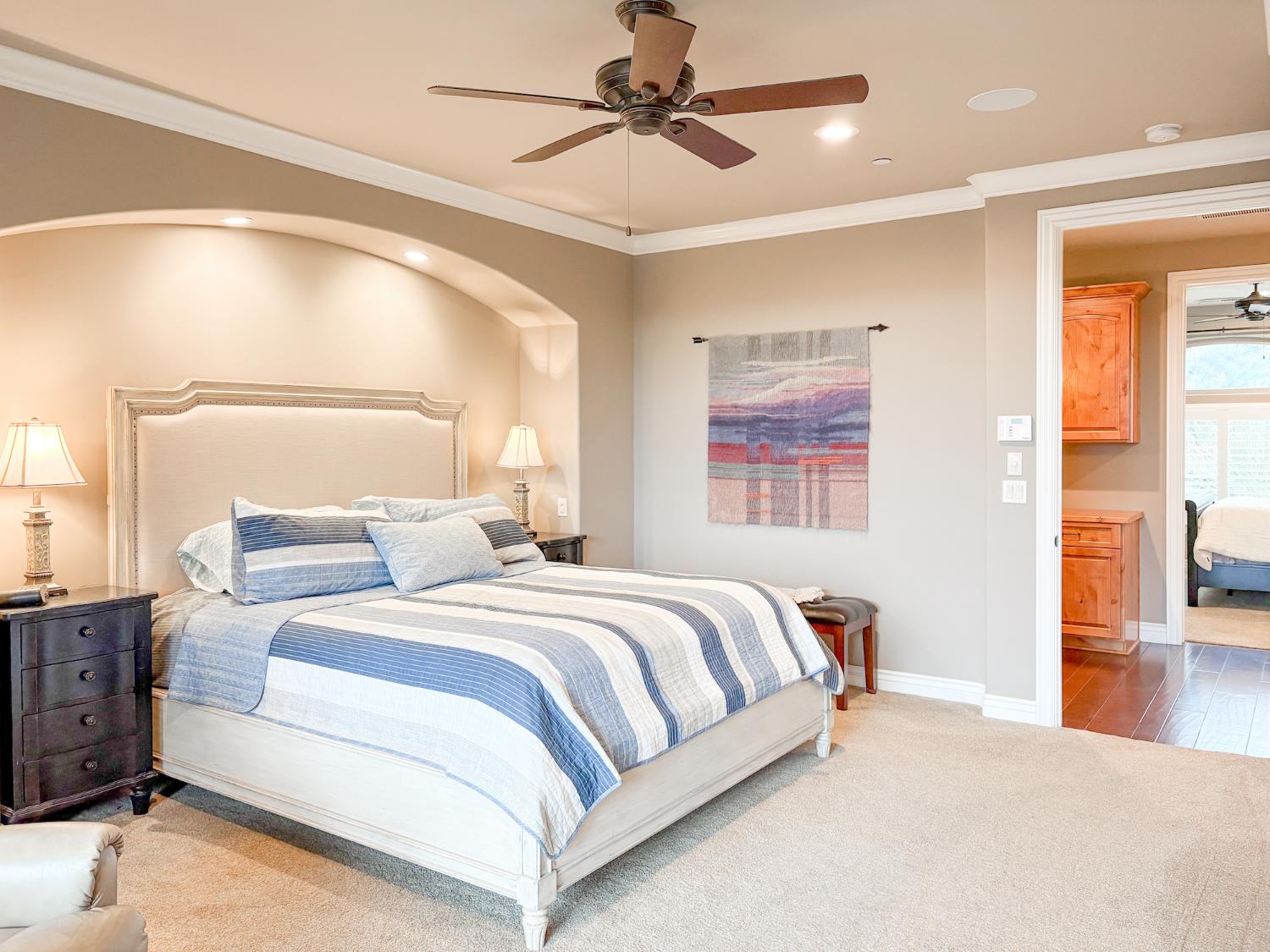 2920 Martel Creek Road Rescue, CA 95672 - Photo 25 of 69 a bedroom with a large bed and a chandelier