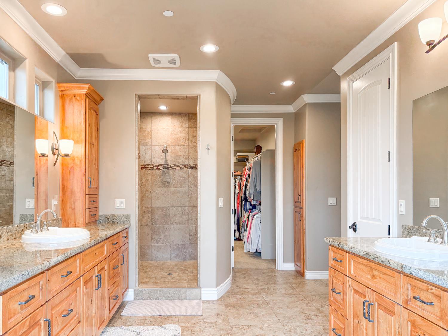 2920 Martel Creek Road Rescue, CA 95672 - Photo 30 of 69 a bathroom with a granite countertop sink a shower and a mirror