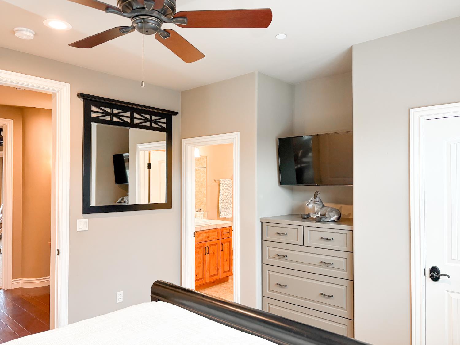 2920 Martel Creek Road Rescue, CA 95672 - Photo 33 of 69 a bedroom with a bed and a flat tv screen on dresser