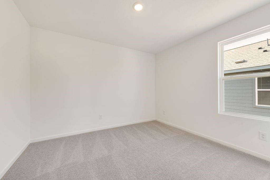 1271 Falcon Hts Drive Forney, TX 75126 - Photo 21 of 29 Empty room featuring light carpet and recessed lighting