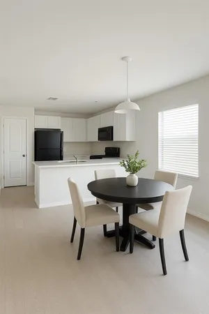 a view of a livingroom with furniture and wooden floor