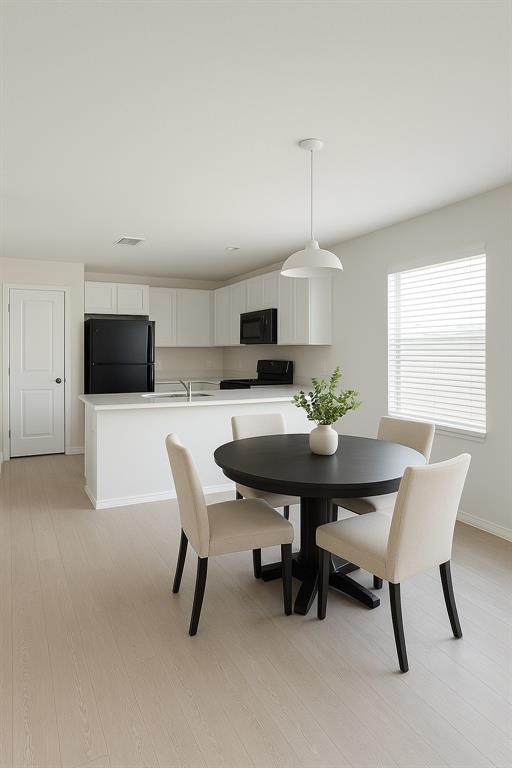 1271 Falcon Hts Drive Forney, TX 75126 - Photo 9 of 29 Dining space with light wood-style floors and baseboards