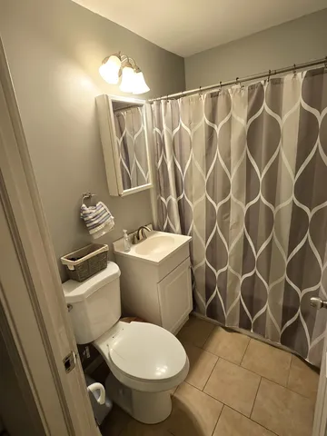 a kitchen with a sink a refrigerator and washer