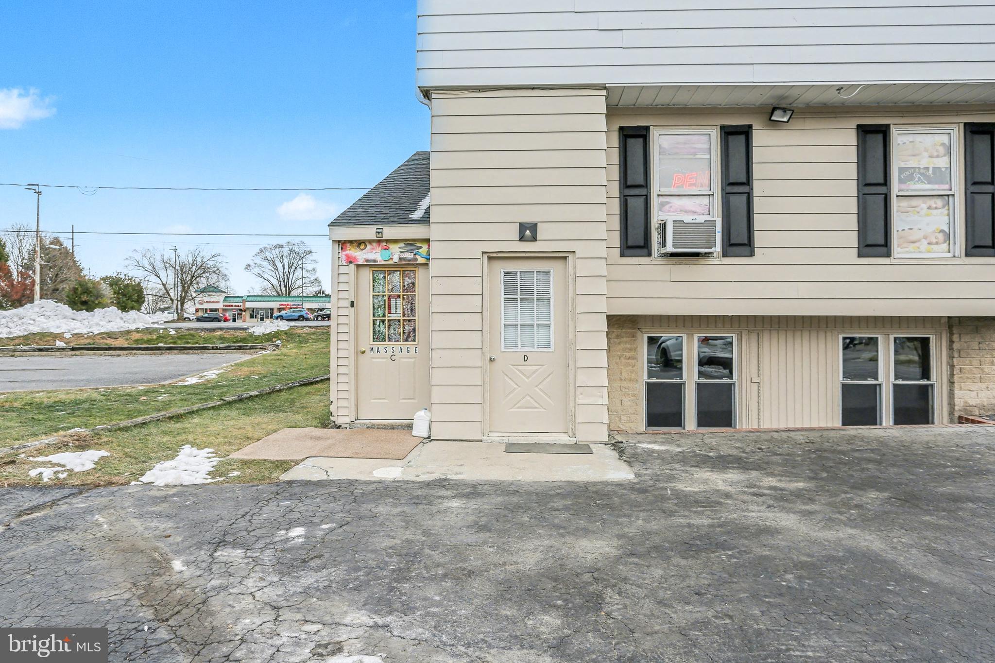 a view of a house with a yard and garage