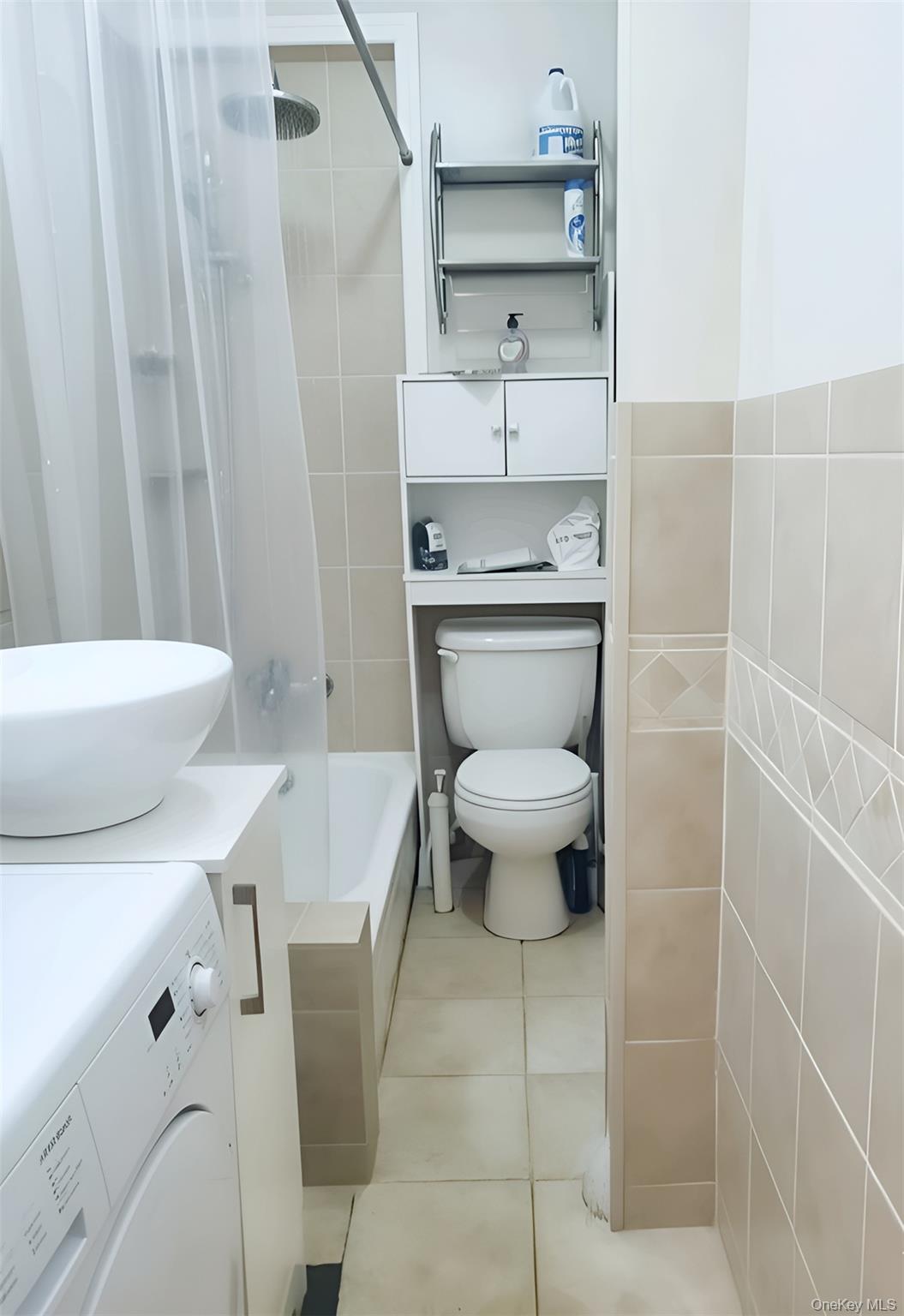 324 East 50th Street, Unit 3A Manhattan, NY 10022 - Photo 11 of 13 a bathroom with a toilet a sink and a shower