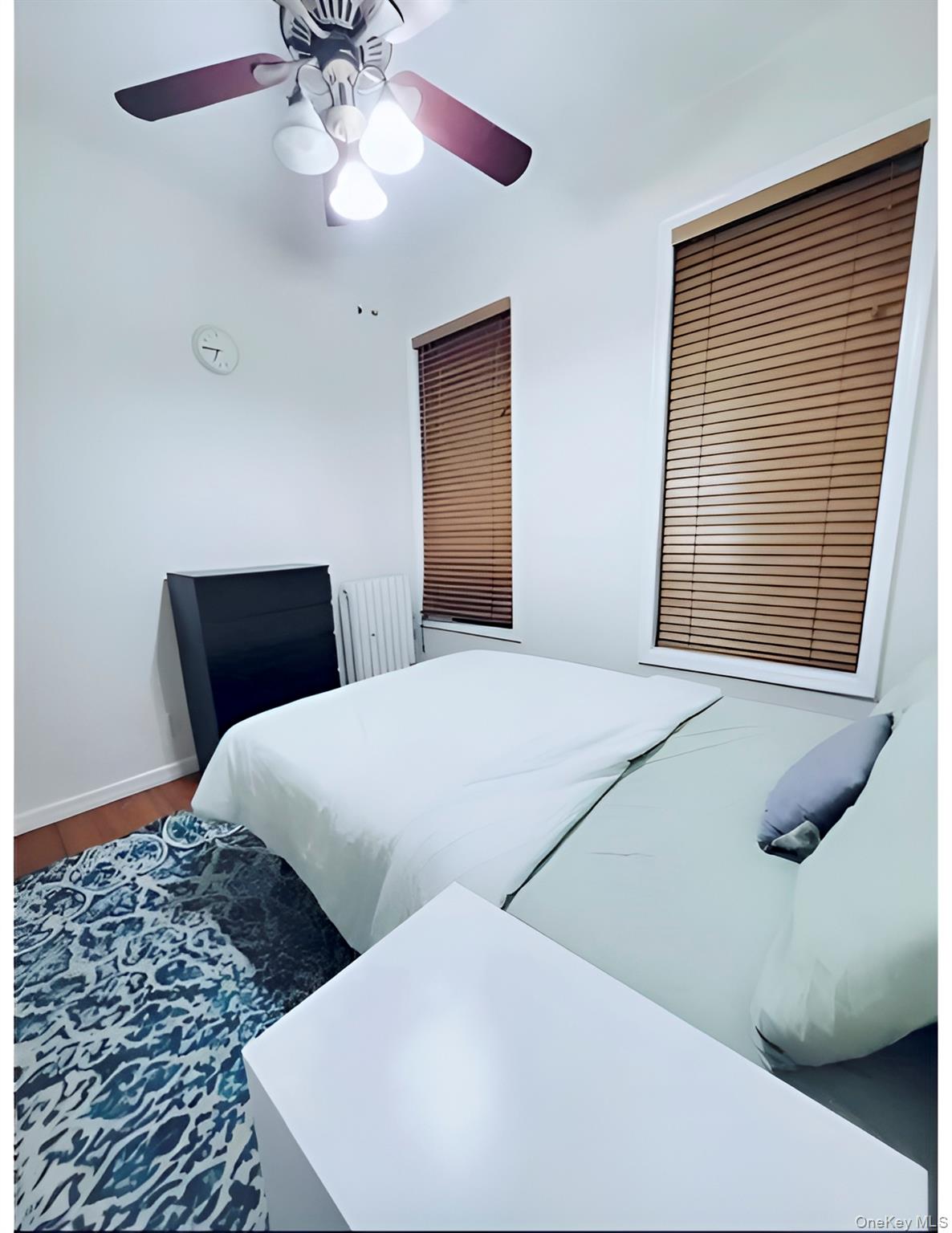 324 East 50th Street, Unit 3A Manhattan, NY 10022 - Photo 2 of 13 a bedroom with a bed and a window