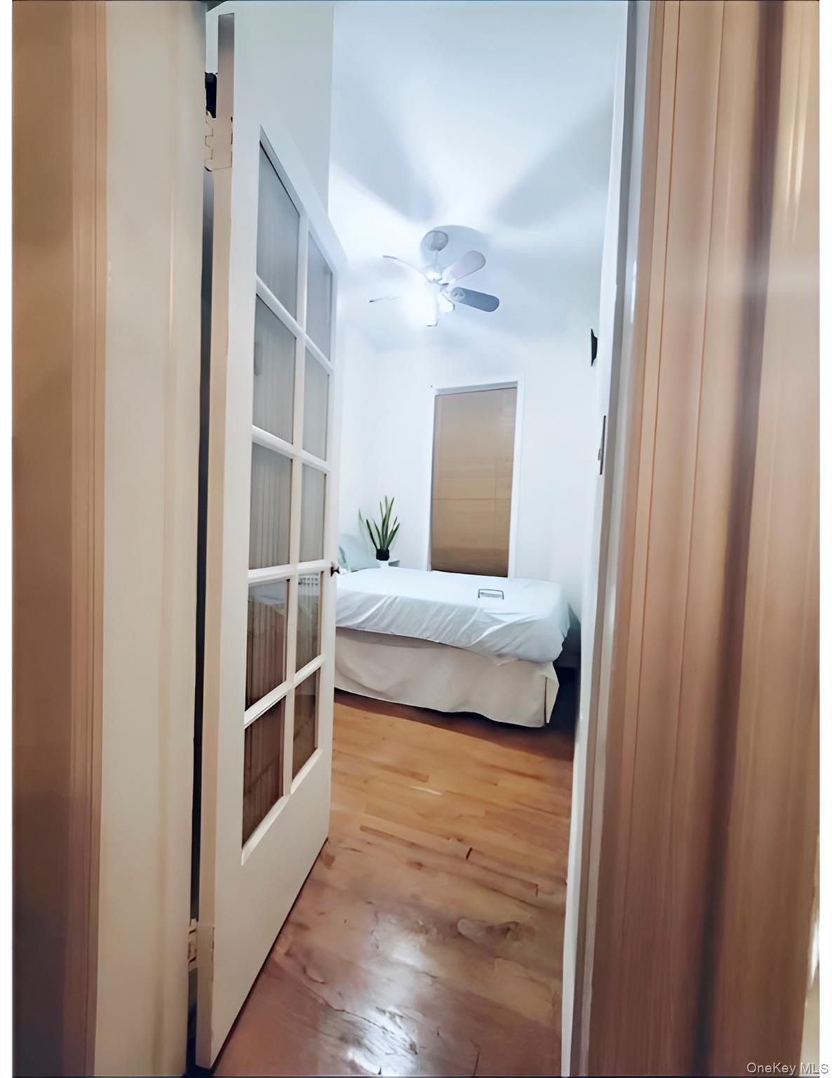 324 East 50th Street, Unit 3A Manhattan, NY 10022 - Photo 3 of 13 a bedroom with a bed and a window