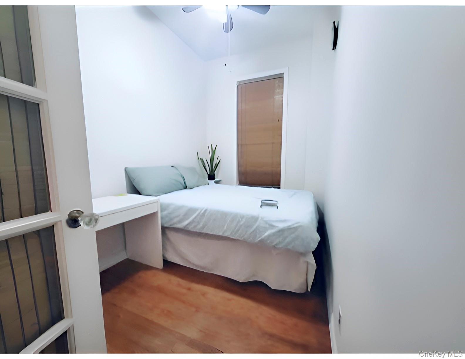 324 East 50th Street, Unit 3A Manhattan, NY 10022 - Photo 4 of 13 a bedroom with a bed and lamps