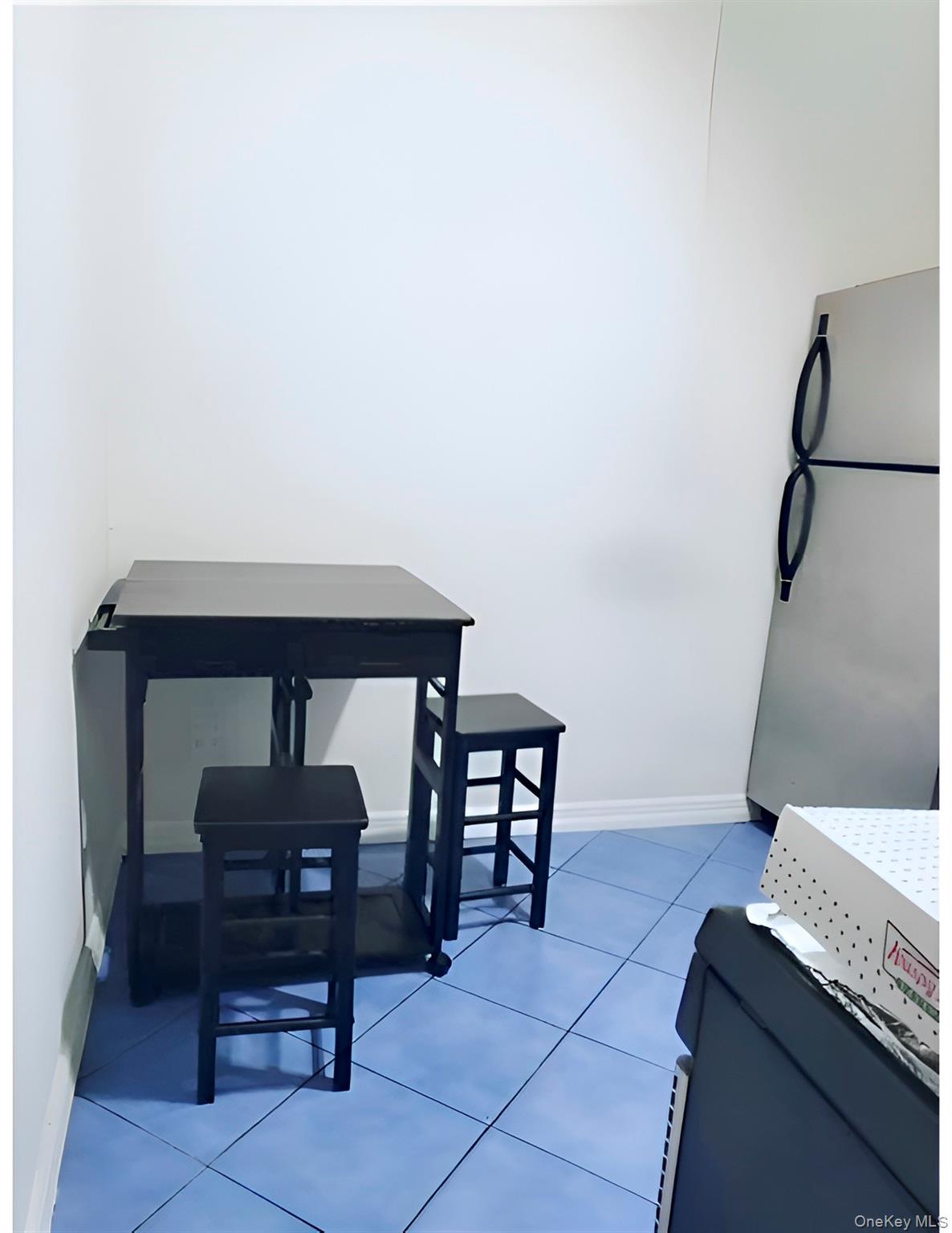 324 East 50th Street, Unit 3A Manhattan, NY 10022 - Photo 10 of 13 a living room with furniture and a table