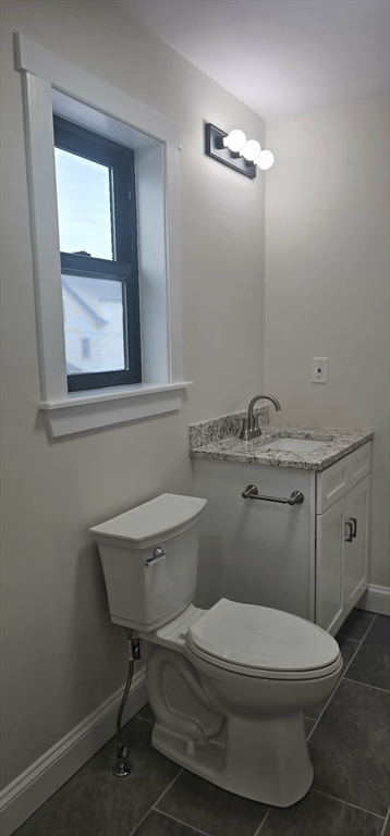31 Niagara Street Fall River, MA 02721 - Photo 12 of 19 a bathroom with a toilet a sink and mirror
