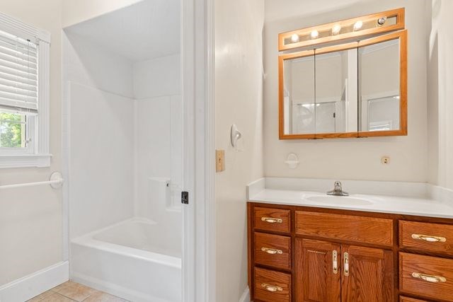 1190 Maple Grove Road Morganton, GA 30560 - Photo 35 of 96 a bathroom with a sink a vanity and a bathtub