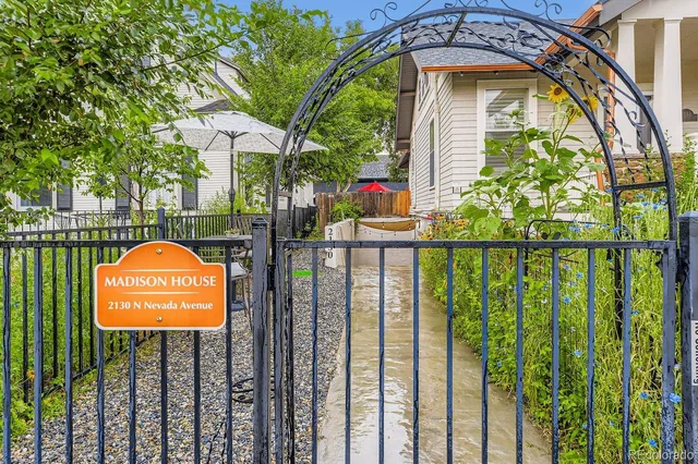 a view of a park with iron fence