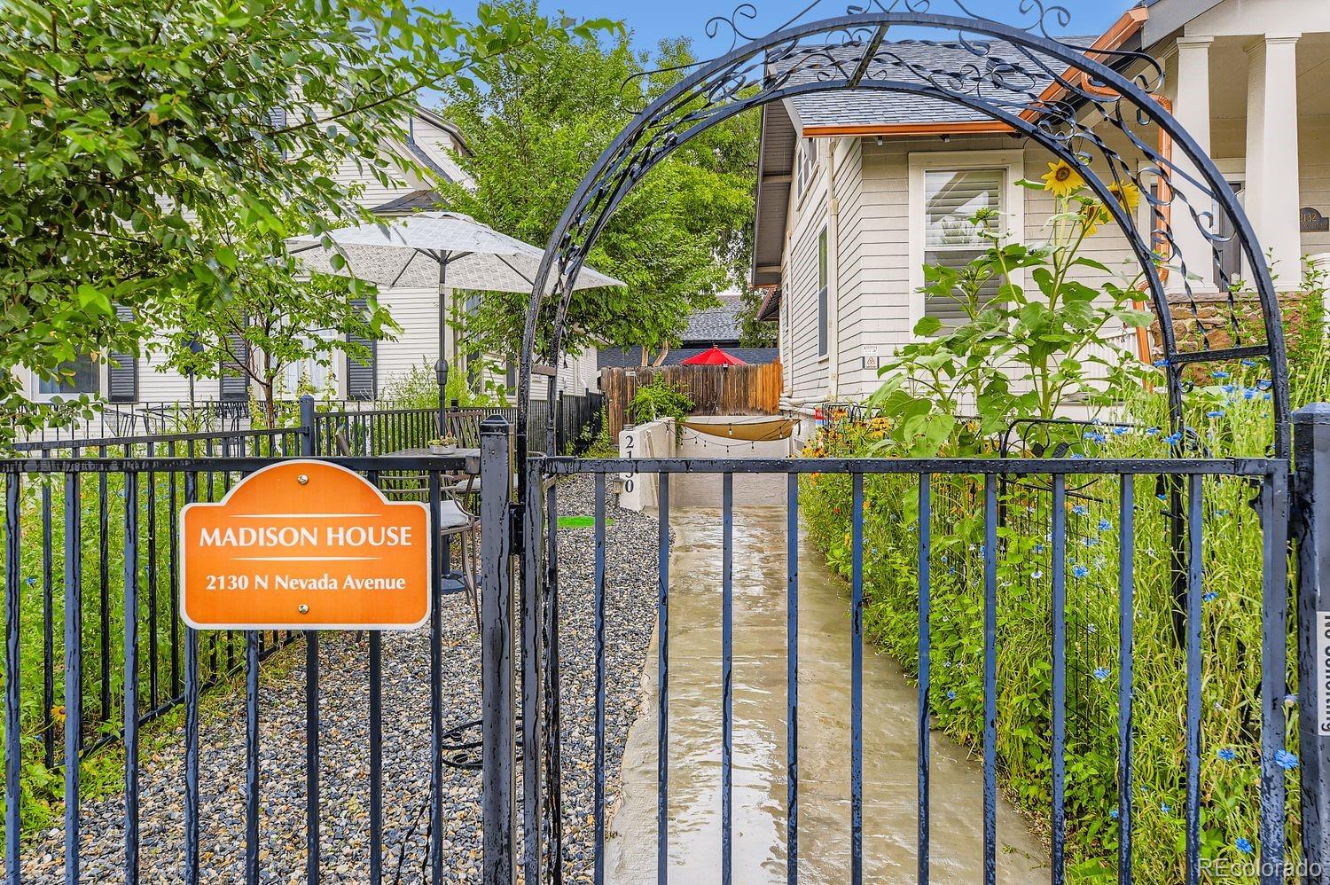 a view of a park with iron fence
